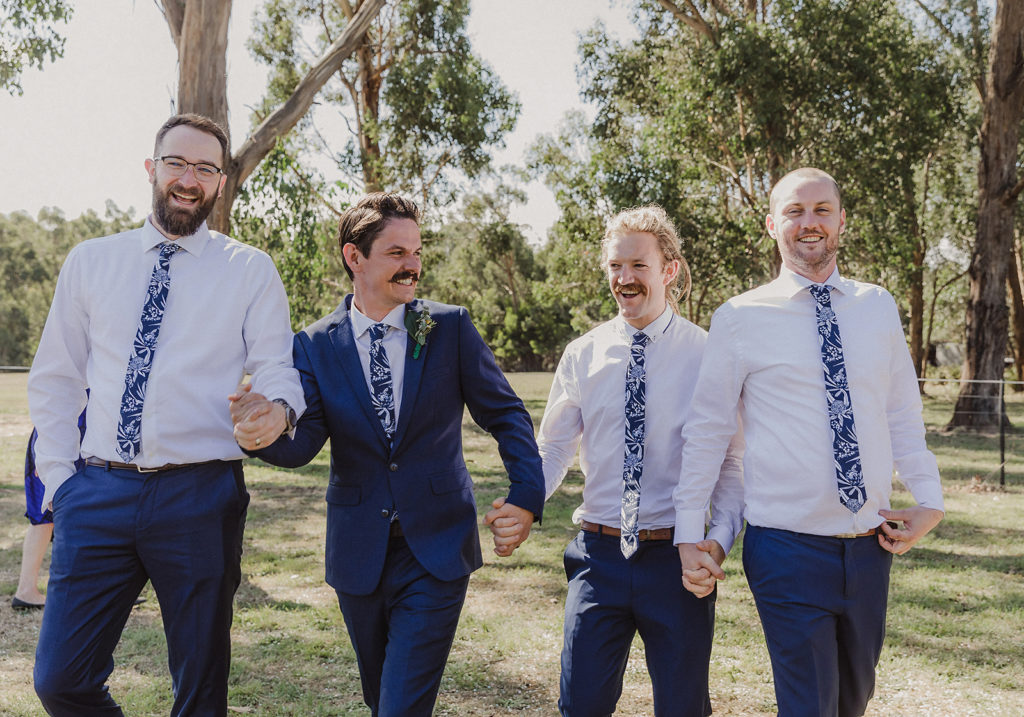 wedding photo of a groom with his groomsmen